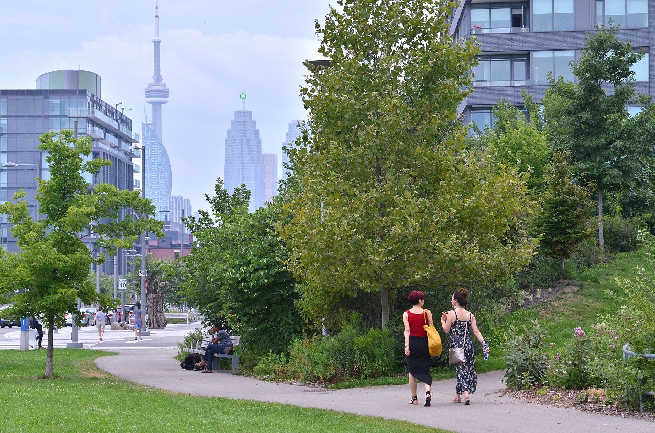 Two woman walking along the paths at Corktown Common