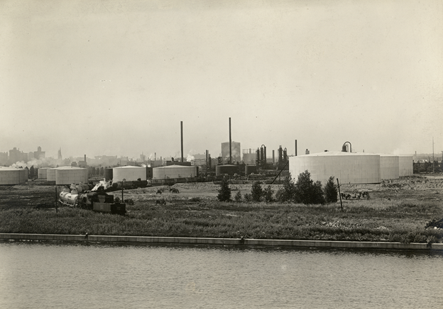 historical image from the 1920s showing oil storage tanks along the waterfront