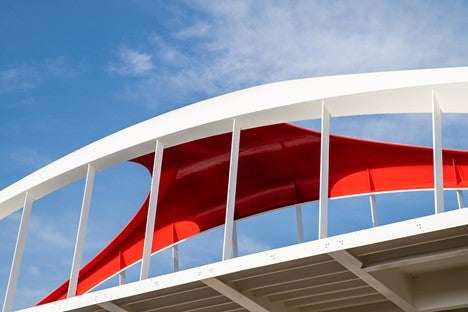 close-up photo of a section of the new Cherry Street Bridge which is white metal and red accent on the interior