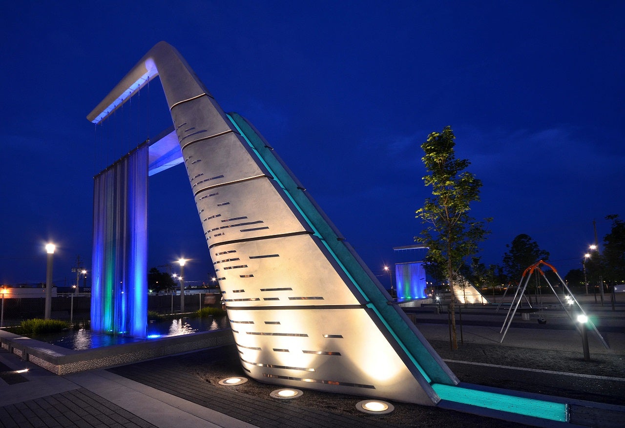 Public art called Light Showers at Sherbourne Common lit up at night