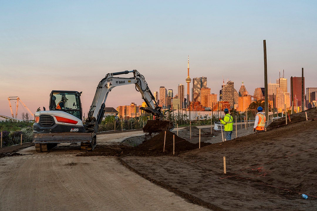 A photograph of Toronto's Port Lands site with machinery.