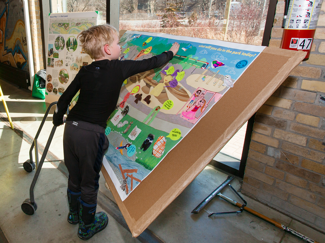 A child playing with a large board