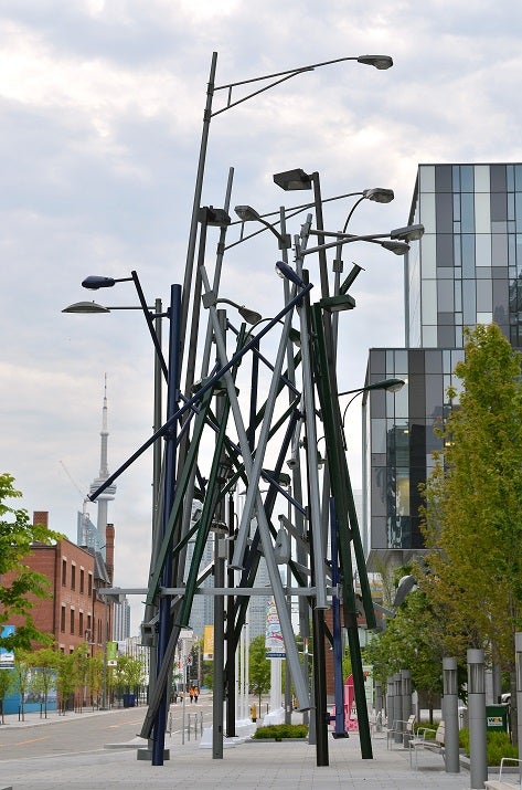 Dozens of lamp posts act as public art on a downtown street