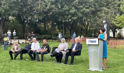 The Mayor of Toronto speaks at a podium for a new park opening