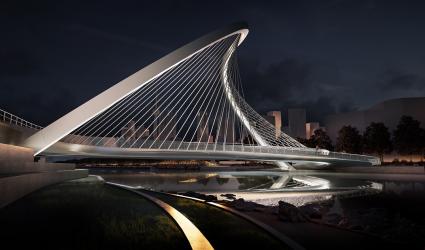 A curvy arched pedestrian bridge shown in a night view rendering.