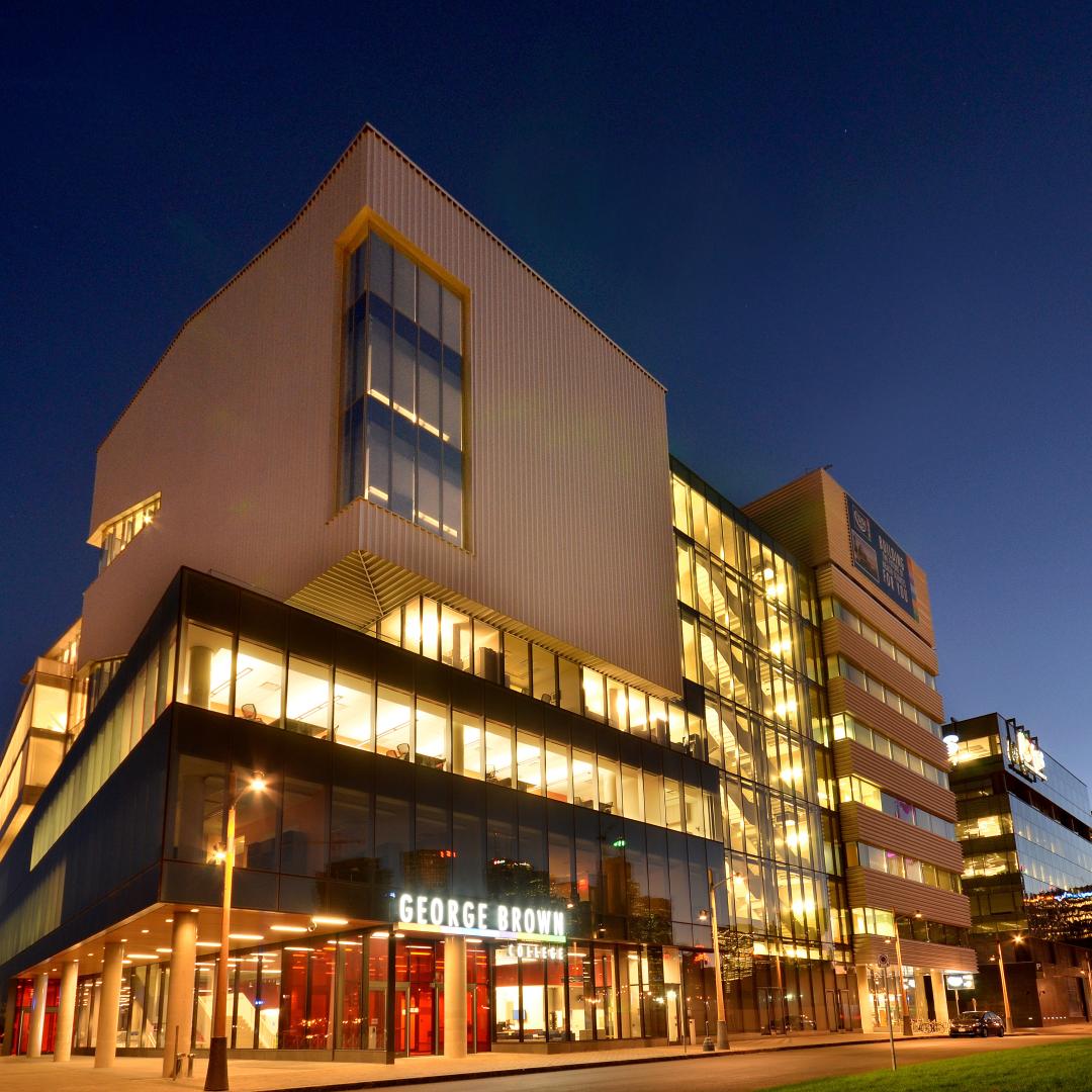a photo of the exterior of the George Brown College at night