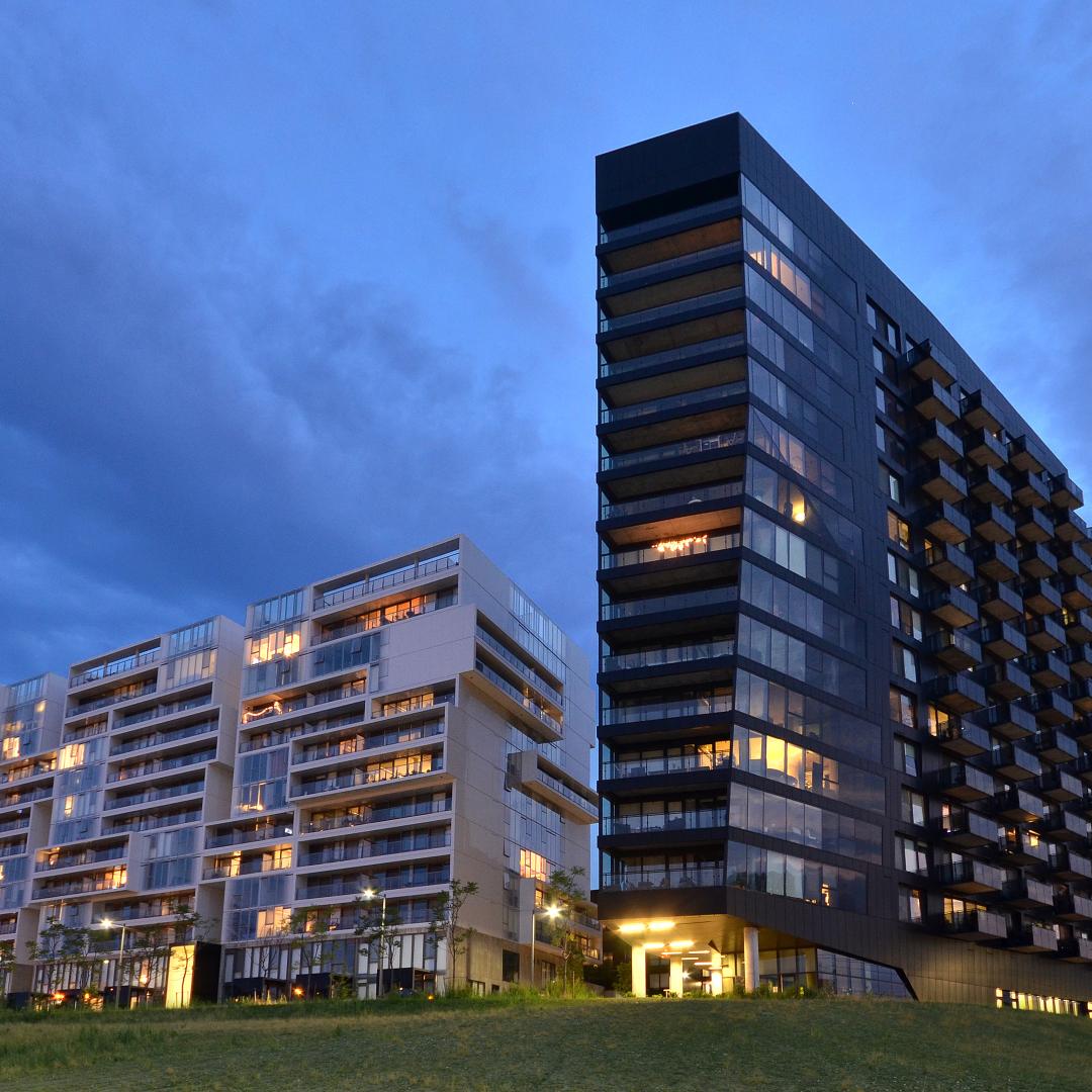 showing the exterior views of the two River City Developments at dusk