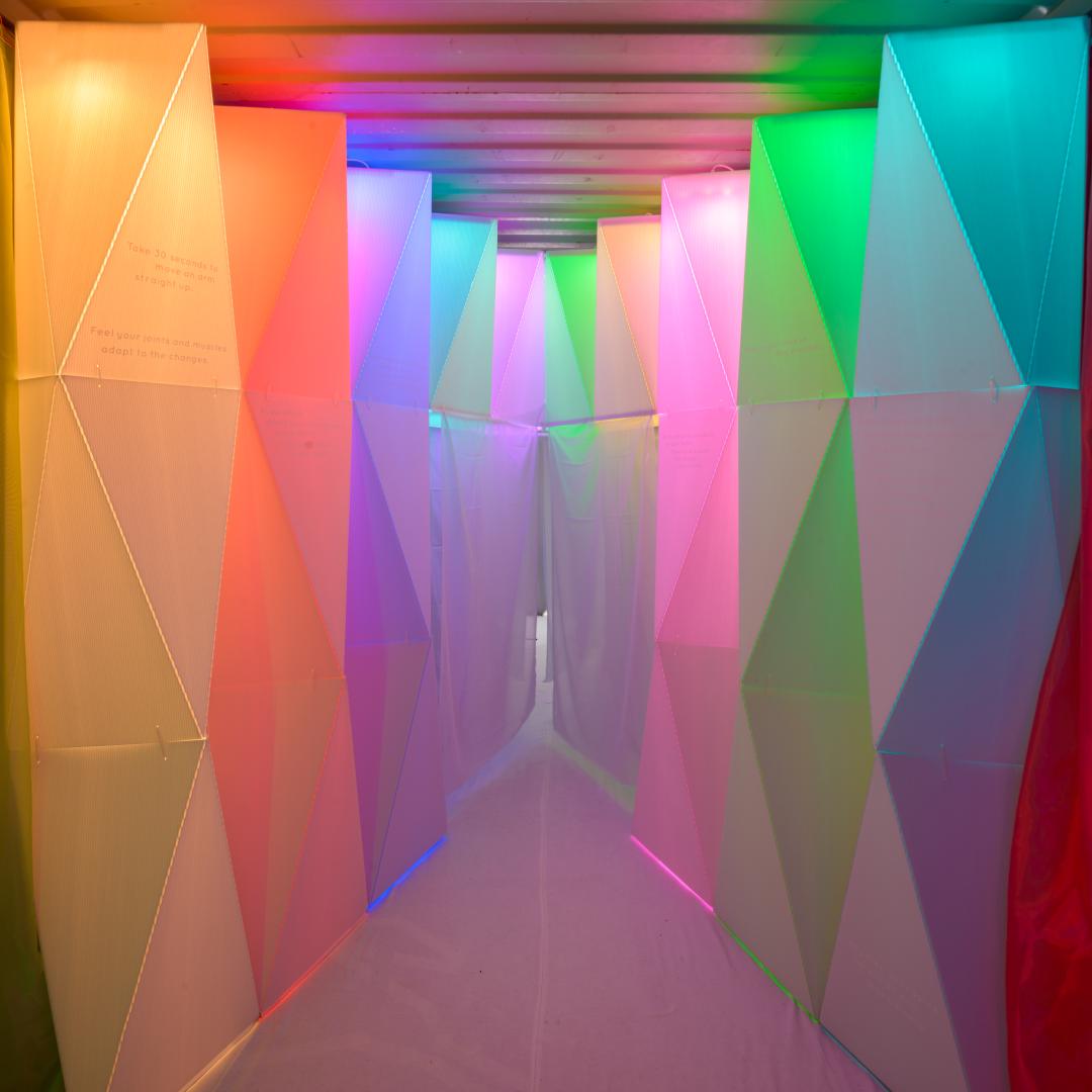 an indoor public art exhibit of panels of coloured lights