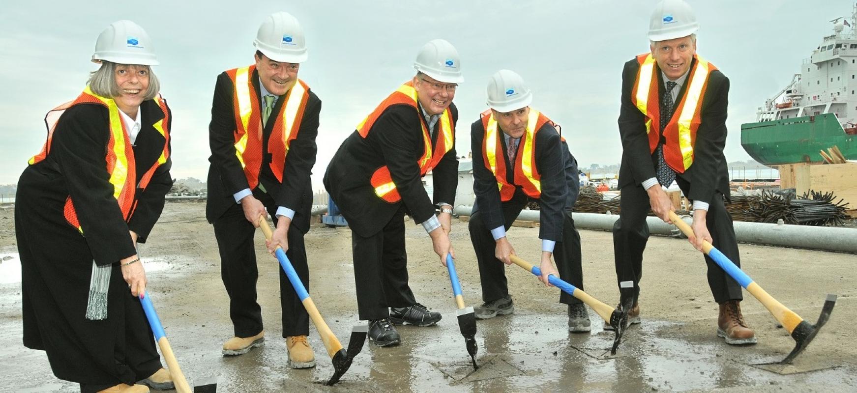 dignitaries posing at a construction groundbreaking event