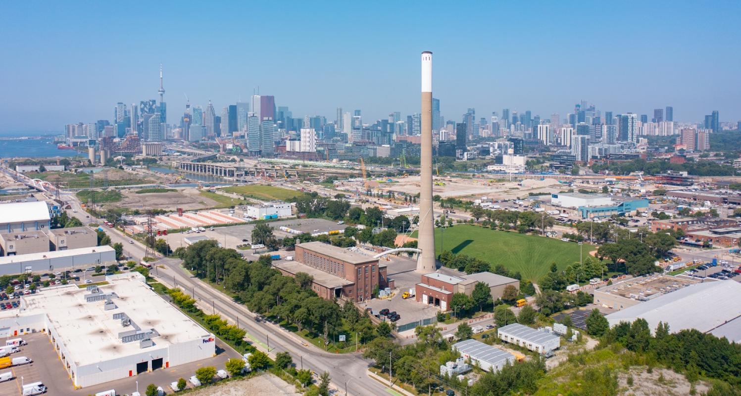 An industrial area with the downtown in the background