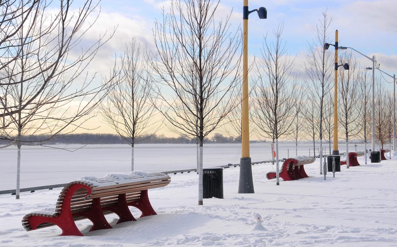 A snow covered Water's Edge Promenade on a sunny winter day.