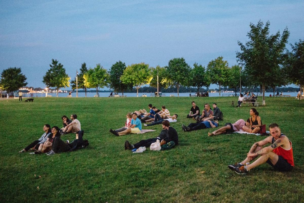 People enjoying a summer evening and the open space at Sherbourne Common