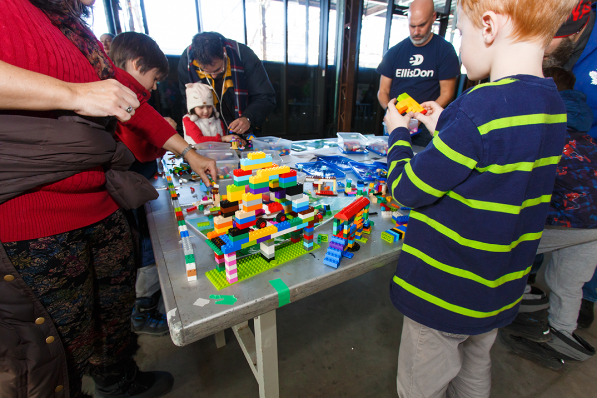 Kids making bridges out of lego