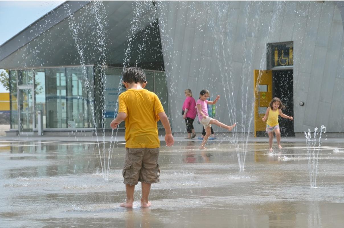 Playing in the water at the Sherbourne Common splash pad