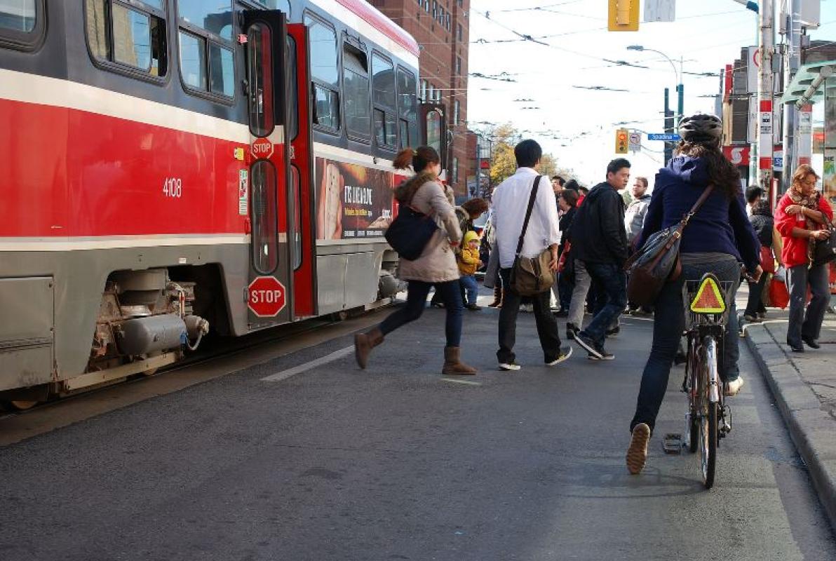 Commuters exit a streetcar in Toronto
