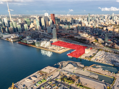 Aerial of downtown core with land parcel outlined in red. 