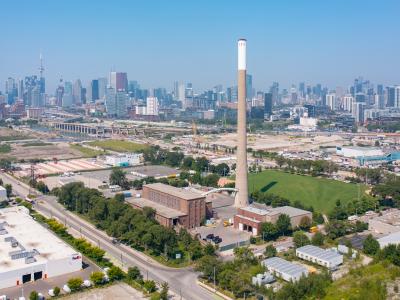 An industrial area with the downtown in the background