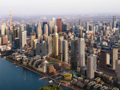 The skyline of Toronto, with Lake Ontario in the foreground and dense downtown buildings beyond.