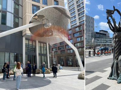 Visitors observing public art, In Equilibrium, with modern buildings in the background, and Garden of Future Follies, with clear sky and buildings in background.