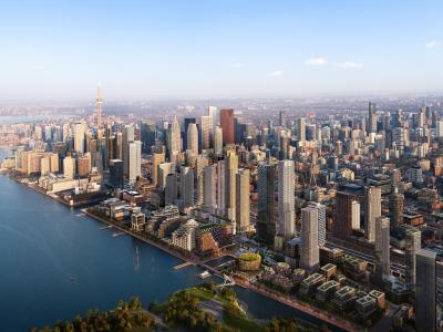 Aerial view of Toronto skyline with CN Tower, along Lake Ontario on a clear day.