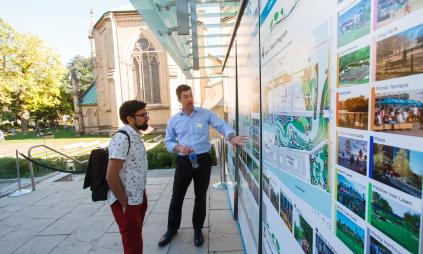people viewing display boards at a public consultation