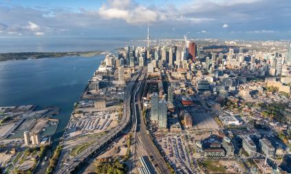 An aerial image of the waterfront and Toronto skyline looking west